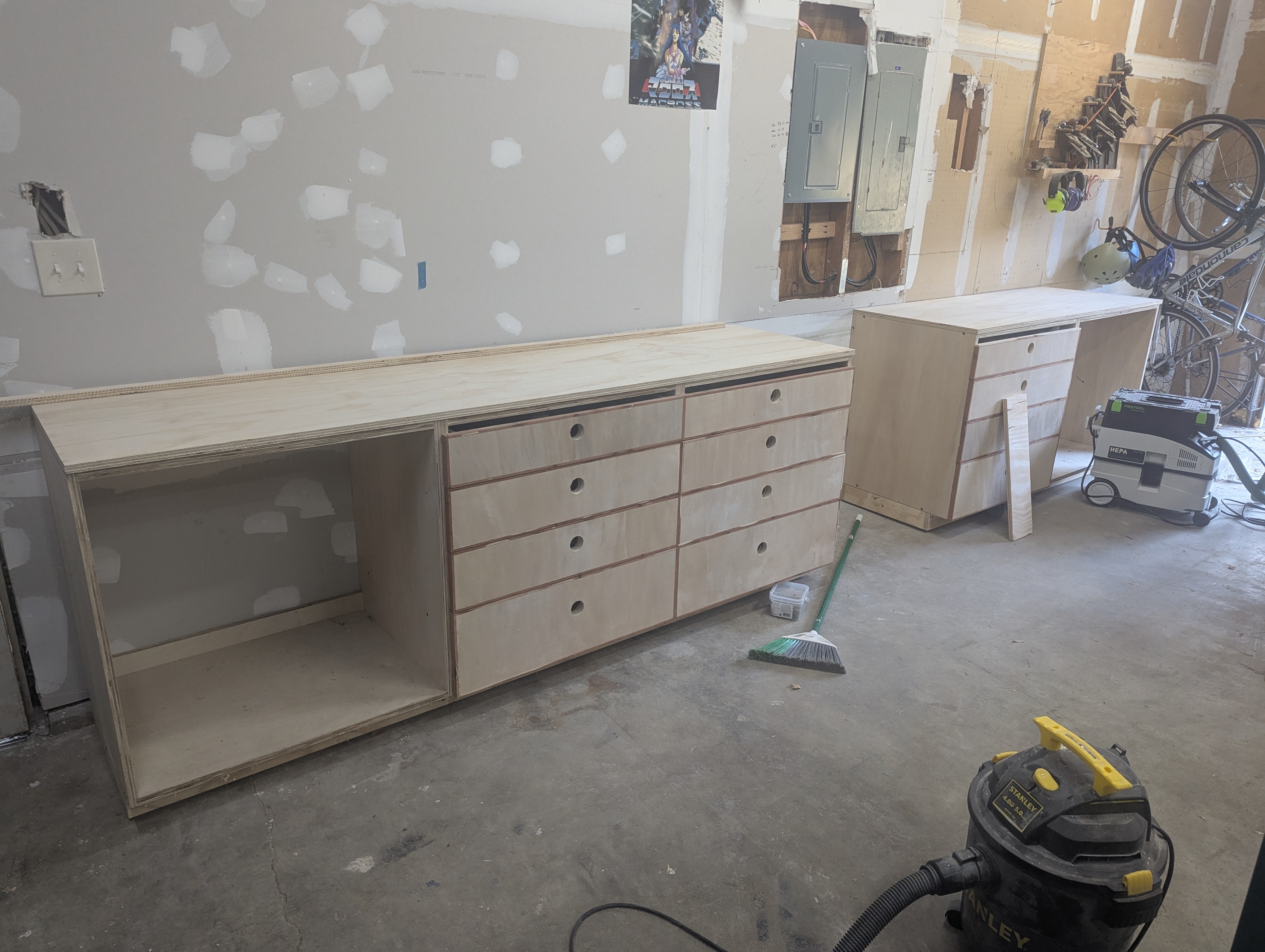 Custom plywood garage cabinets with drawers and open storage