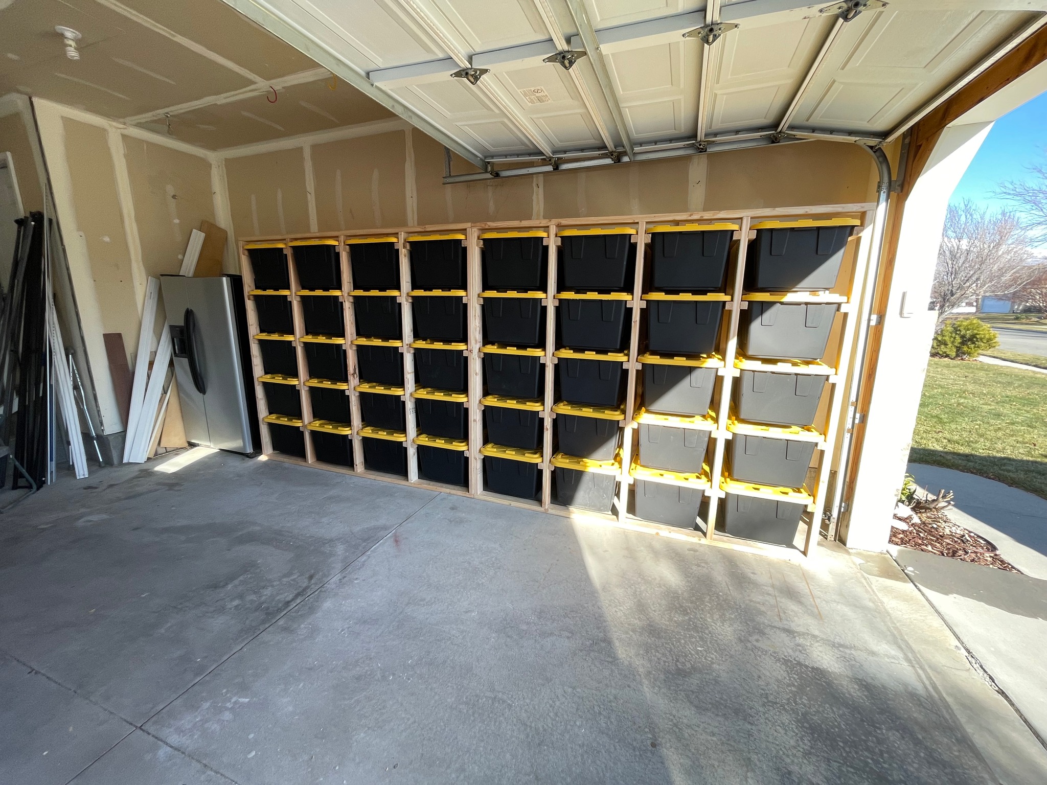 Large wall-to-wall tote rack system installed in a garage